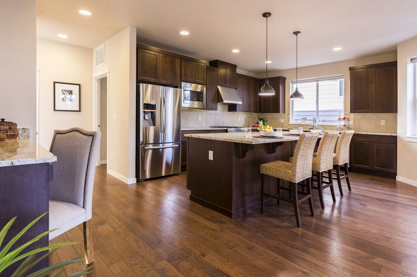 Warm neutral kitchen with island and wood accents