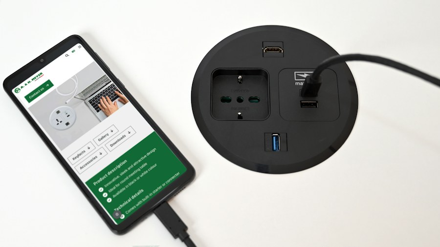 Desktop power socket charging a smartphone